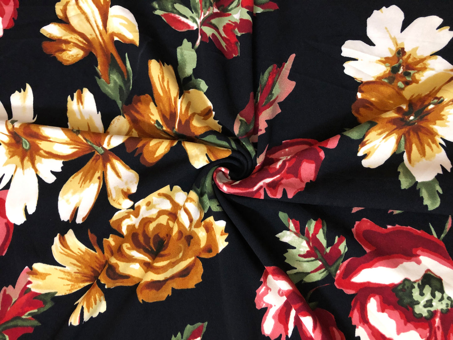 Techno Crepe Knit Fabric – Black with Marigold & Ivory Blooms, Red Rose Florals, Green Leaves – 4-Way Stretch, 56" Wide, 240 GSM – Sold by the Yard (TCRP046)