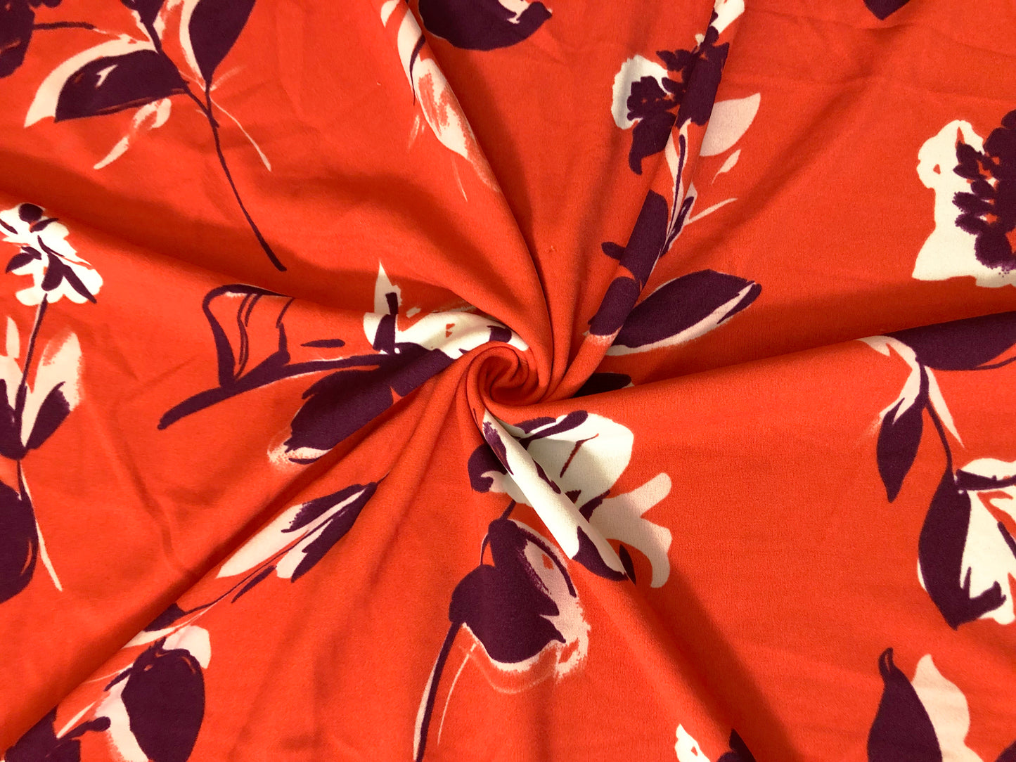 Techno Crepe Knit Fabric – Intense Orange with Deep Plum & Ivory Florals – 4-Way Stretch, 56" Wide, 240 GSM, Silky Drape – Sold by the Yard (TCRP034)