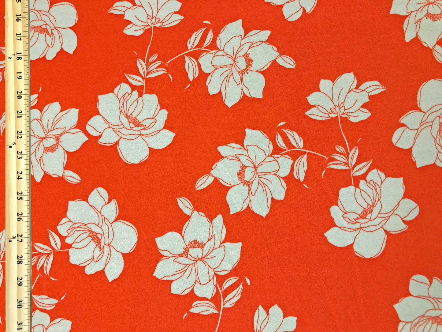Techno Crepe Knit – Vivid Orange with Ivory Line-Art Florals, 4-Way Stretch, 56" Wide, 240 GSM - By the Yard (TCRP070)