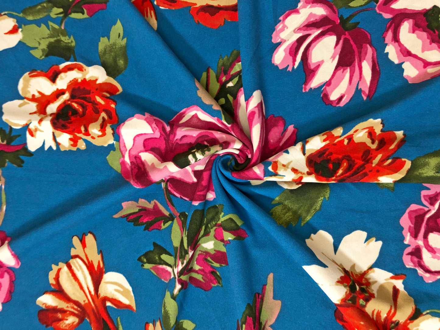 Techno Crepe Knit Fabric – Teal Blue with Fuchsia, Red & Ivory Florals, Green Leaves – 4-Way Stretch, 56" Wide, 240 GSM, Silky Drape – Sold by the Yard (TCRP041)