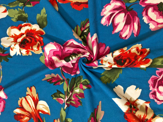 Techno Crepe Knit Fabric – Teal Blue with Fuchsia, Red & Ivory Florals, Green Leaves – 4-Way Stretch, 56" Wide, 240 GSM, Silky Drape – Sold by the Yard (TCRP041)