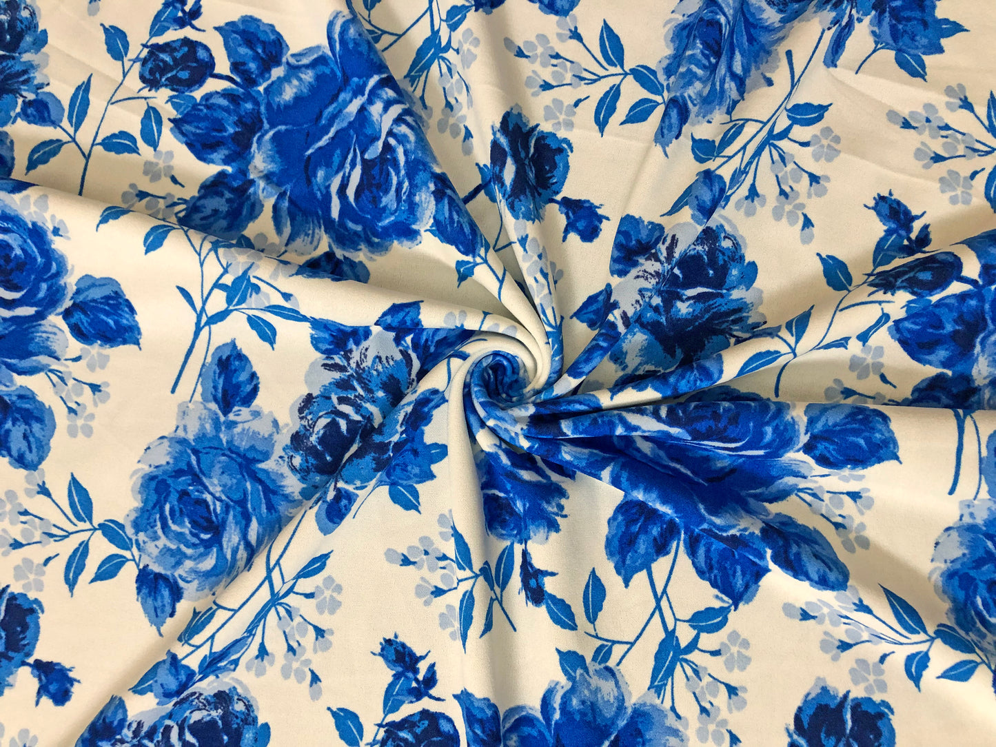 Techno Crepe Knit Fabric – White with Cobalt & Royal Blue Roses – 4-Way Stretch, 56" Wide, 240 GSM, Silky Drape – Sold by the Yard (TCRP037)
