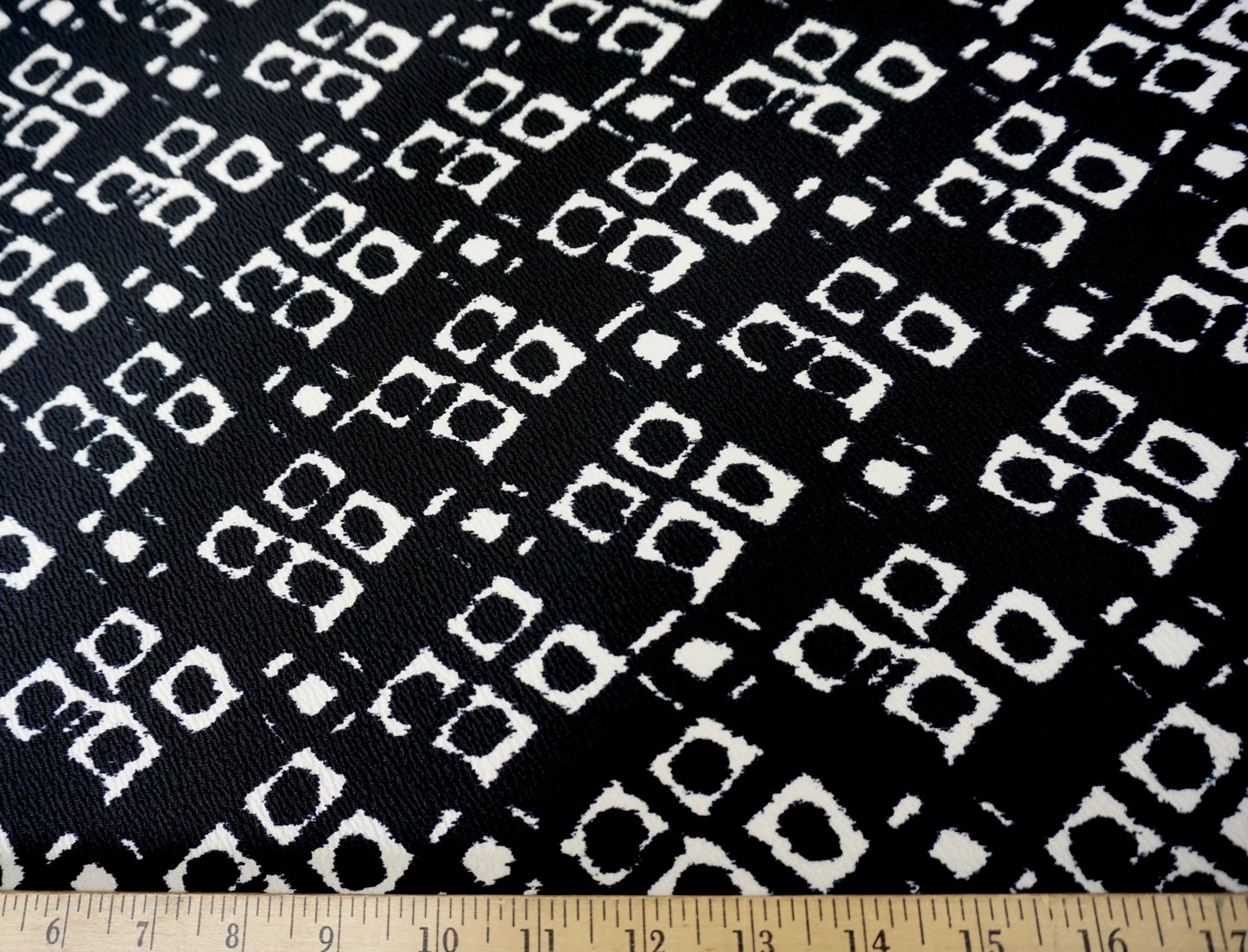 Liverpool Knit – Black & Ivory Geometric Bots Eyes – 4-Way Stretch, 56″ Wide, 200 GSM – Sold by the Yard (LVPR160)