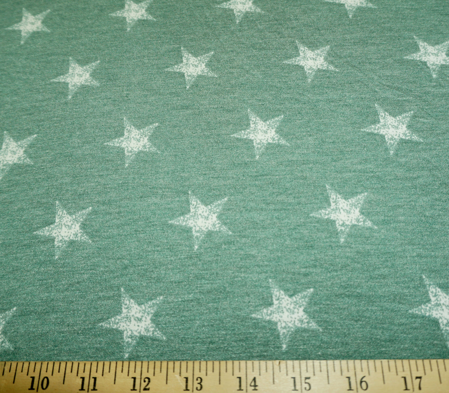 Star Print Jersey Knit Fabric – Green with White Stars – 65% Polyester / 32% Rayon / 3% Spandex – 58″ Wide – Sold by the Yard (PRSXPR05)