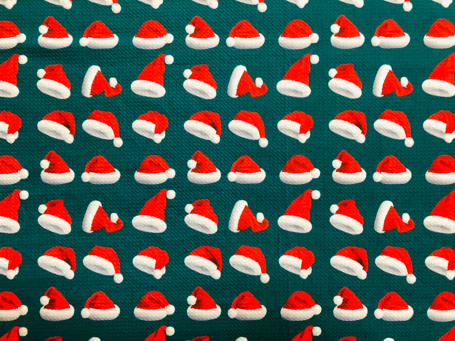 Premium Bullet Knit Fabric – Red & White Santa Hat Print on Hunter Green, 56″ Wide, Sold by the Yard (BPR189)
