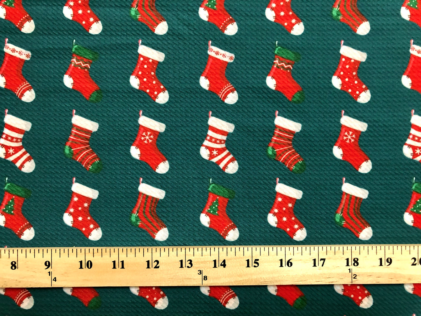 Premium Bullet Knit Fabric – Festive Red Stocking Print on Hunter Green, 4‑Way Stretch, 56″ Wide, Sold by the Yard (BPR190)