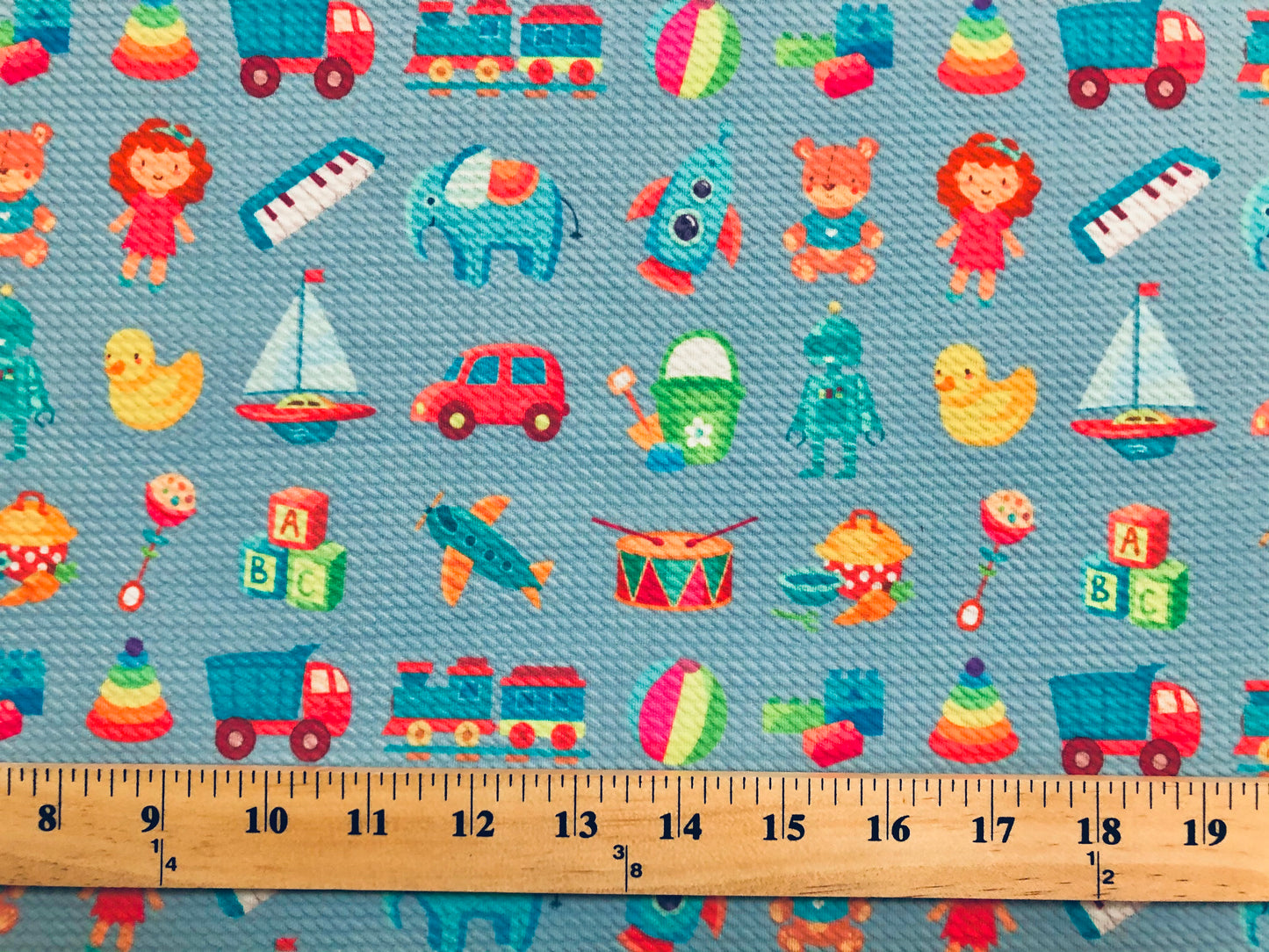 Bullet Knit Stretch Fabric – Colorful ABC Blocks, Trains & Toys Print on Blue, 56″ Wide, Sold by the Yard (BPR208)