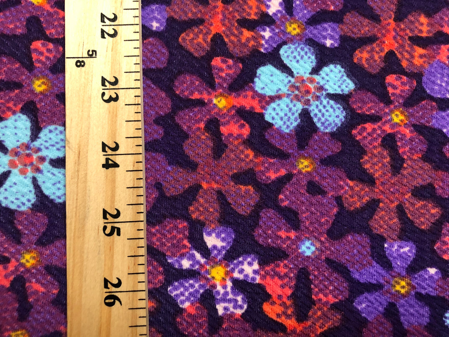 Premium Bullet Knit Fabric – Purple & Blue Ditsy Floral Print on Black, 56″ Wide, Sold by the Yard (BPR245)