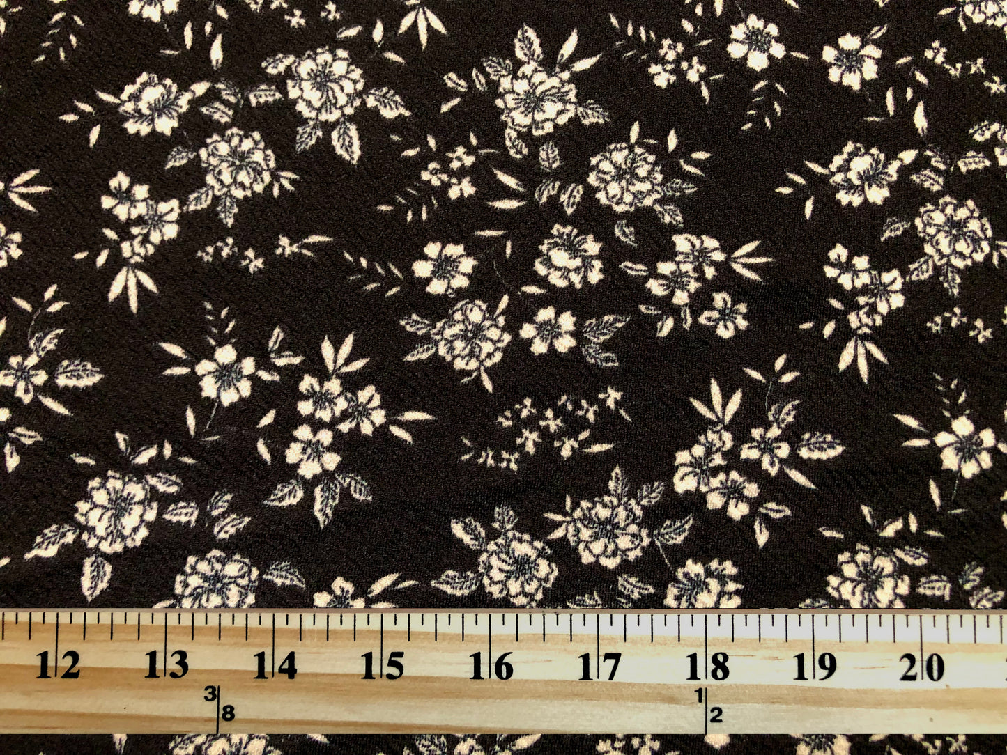 Liverpool Knit Fabric – Black & Ivory Ditsy Floral – 4-Way Stretch, 56” Wide, 200 GSM – Sold by the Yard (LVPR251)